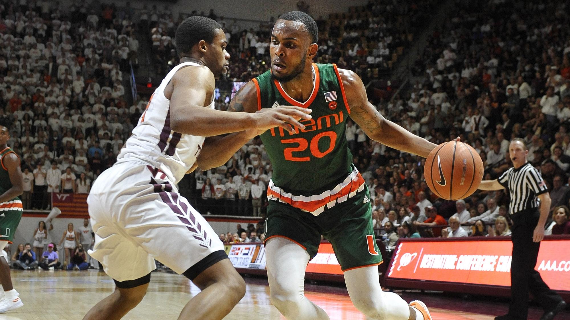Miami's Dewan Huell drives to the basket